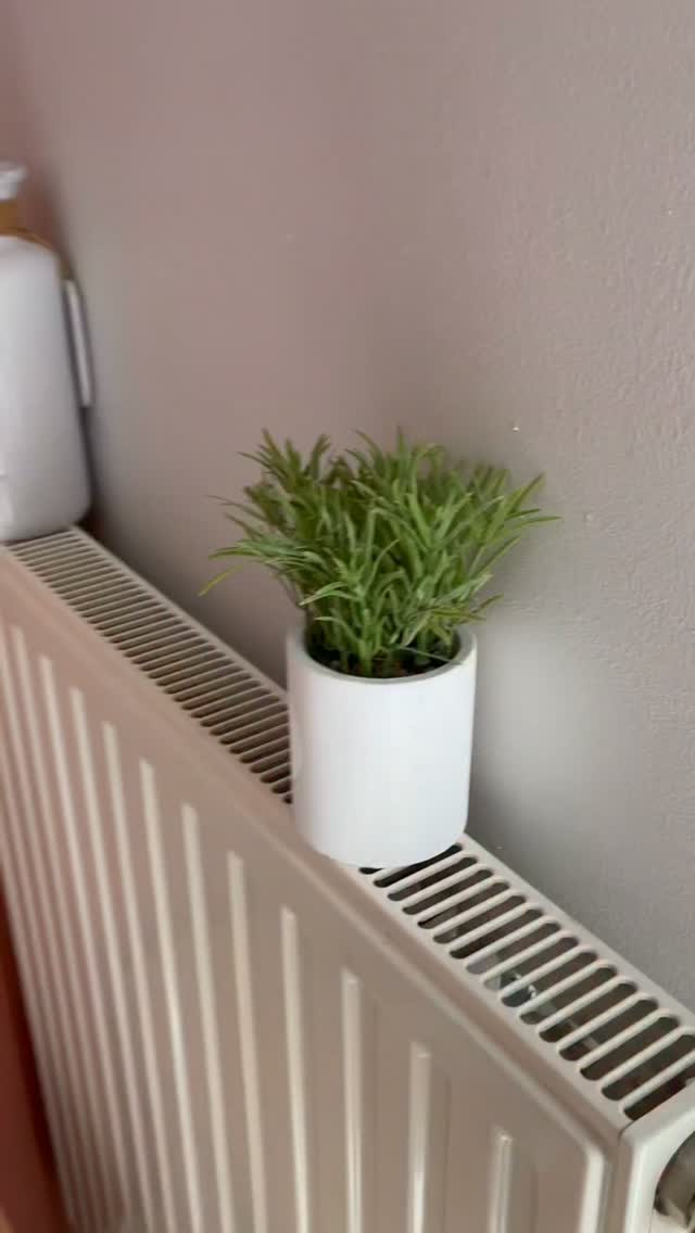 No drill, no screws, no holes. My landlord will never know this shelf existed.

It hooks over the radiator, the weight o...